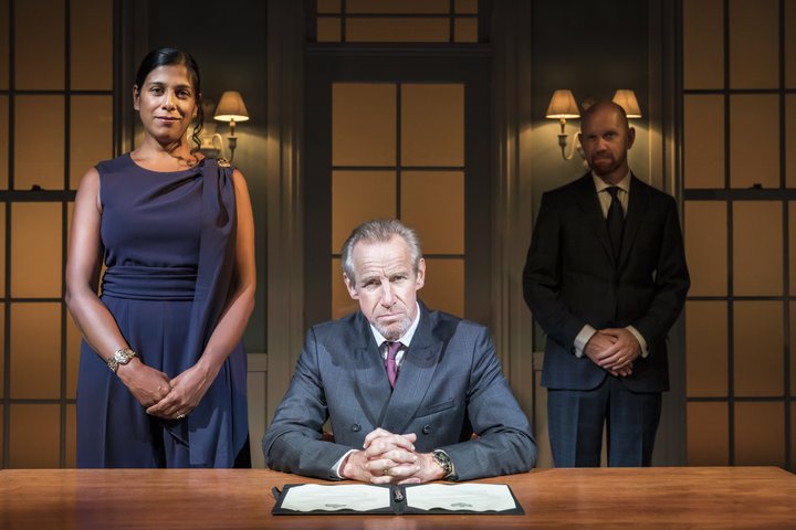 Lolita Chakrabarti, Nicholas Farreel and Sean Foley face the camera on the set for Hamlet in the Jerwood Vanbrugh Theatre