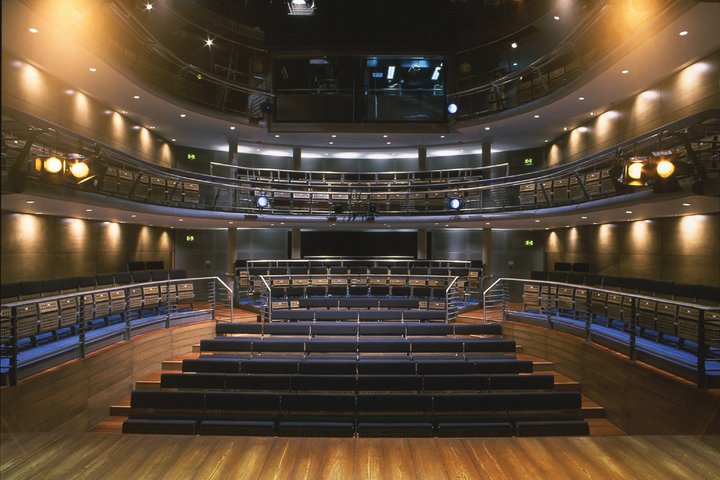 An empty auditorium showing the Jerwood Vanbrugh Theatre at RADA with stalls and circle seating