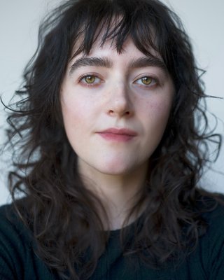 Headshot of Rebel Devine