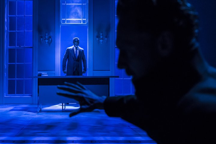 Ansu Kabia as the ghost of King Hamlet with Tom Hiddleston as Hamlet in the foreground in a scene from Hamlet