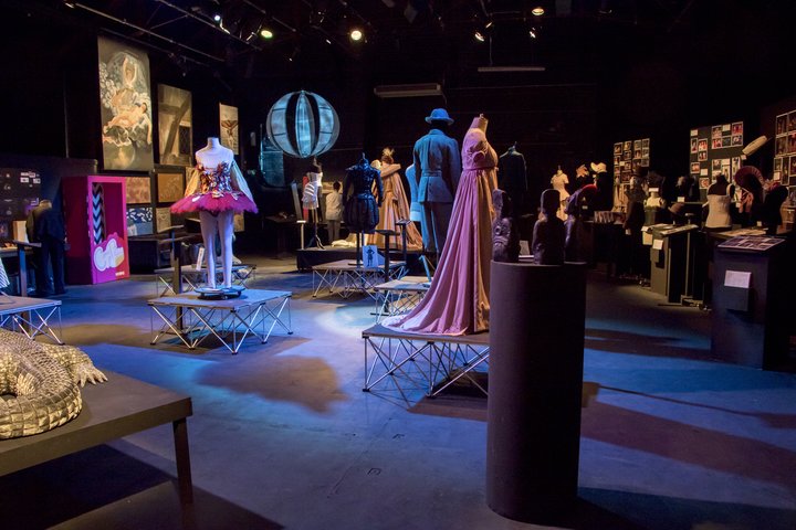 Image of exhibition installed, showing costume, scenic art and props