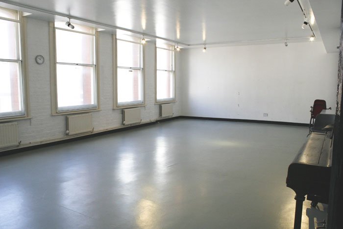 empty Fanny Kemble rehearsal studio at RADA with upright piano
