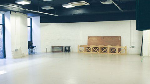 empty Jerwood Vanbrugh studio with benches and stacked chairs