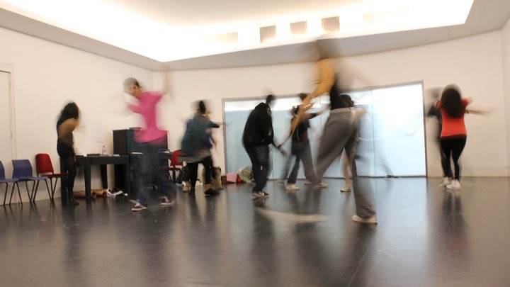 group of students blurred in acting workshop in rehearsal studio