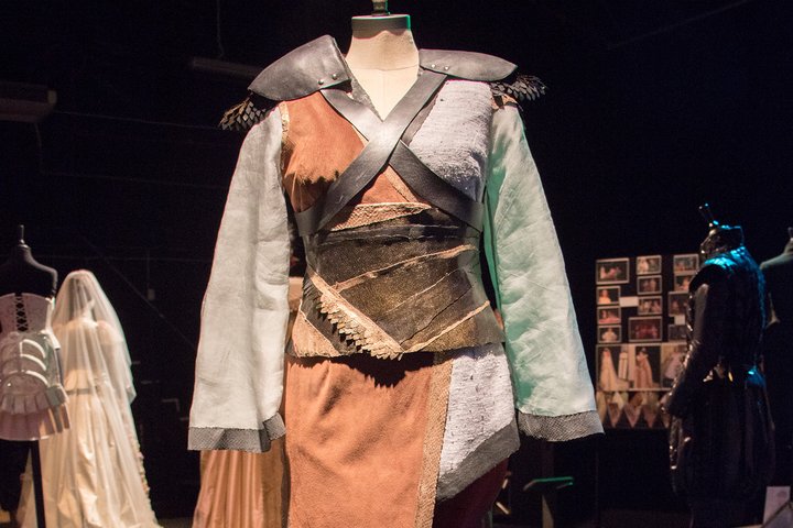medieval-looking tunic with leather armour criss-crossing it
