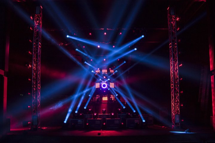 Red and blue lighting design interlacing over an empty stage