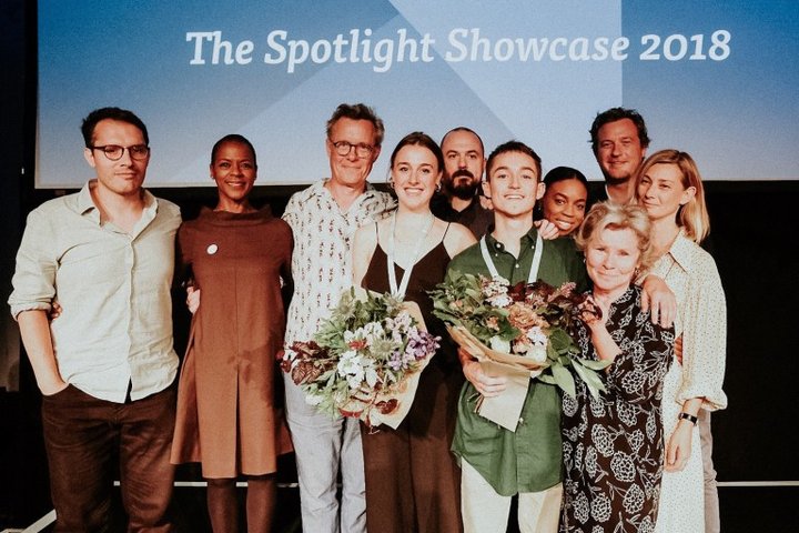 Group of winners and judges of the Spotlight Prize 2018 including RADA student Lucie Sword centre with medal and flowers