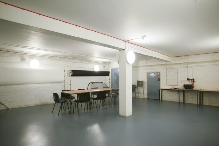 empty studio 7 with table and chairs