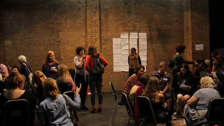 groups of women in discussions in the GBS Theatre at RADA